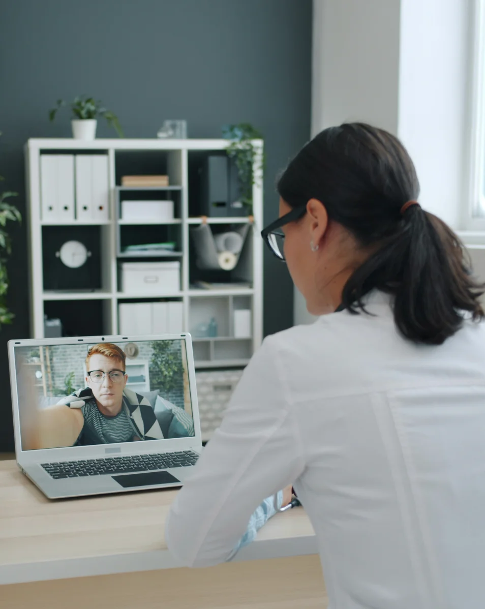 A client joining a secure telehealth therapy session from home
