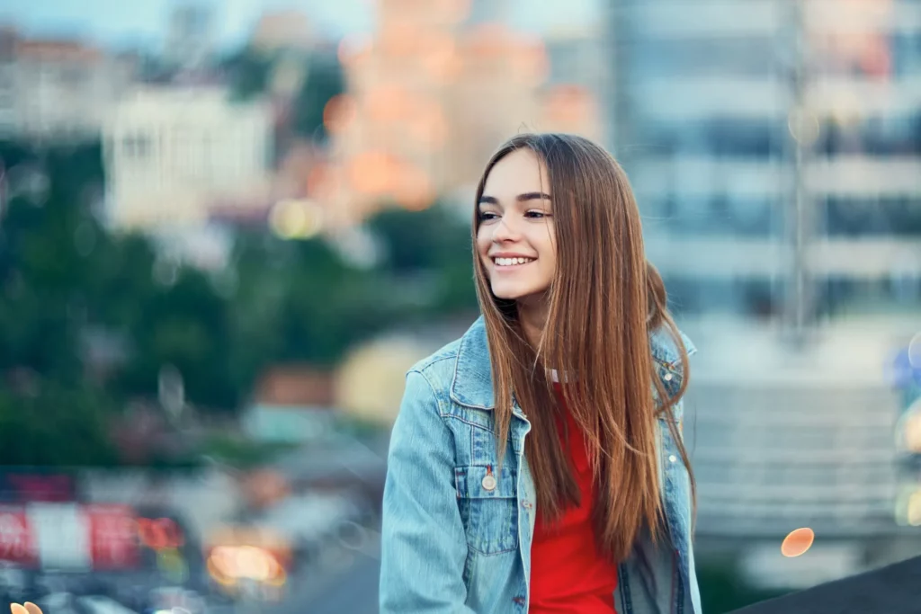 Lovely teen girl on cityscape background